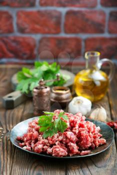 minced meat with salt and spice on a table
