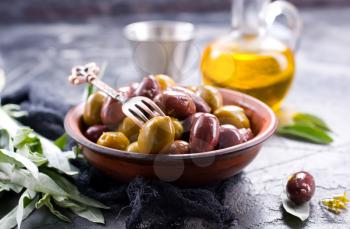 olives in bowl and on a table