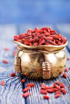 dry gojy berries on a kitchen table