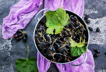 black currant in bowl and on a table