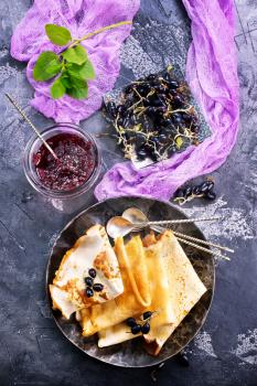 pancakes with berries on plate, stock photo
