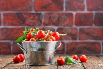 tomato cherry in bowl and on a table