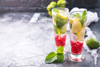 cold lemonad with raspberry in the glasses