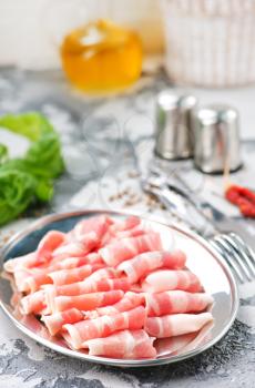 bacon with spice on the metal plate, stock photo