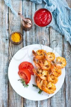 fried shrims with tomato sauce and lemon