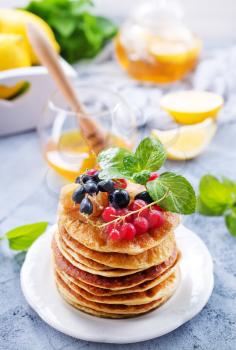 pancakes on white plate and on a table