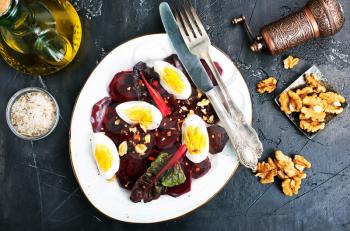 boiled beet with eggs on plate, beet salad