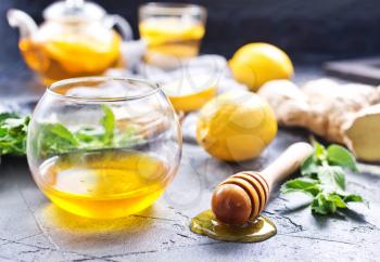 honey,fresh mint and lemons on a table