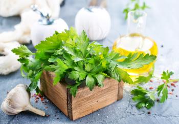 fresh parsley in wooden box and on a table