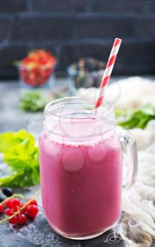 fresh smoothie with fresh berries on a table