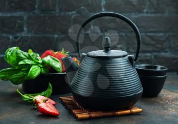 Tea with fresh basil and strawberry, fresh herbal tea