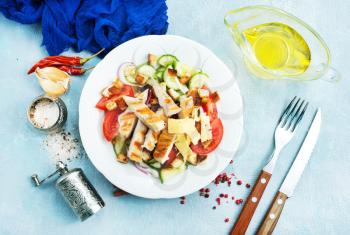 salad with fresh vegetables and baked chicken fillet