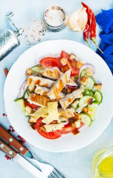 salad with fresh vegetables and baked chicken fillet
