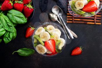 desert with fresh fruits, fruit salad, banana with strawberry