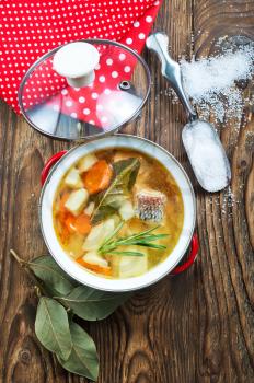 fish soup in bowl, fish soup with spice and greens