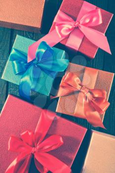box for present with ribbons on a table