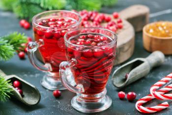 cranberry drink and berries, christmas drink in glass and on a table