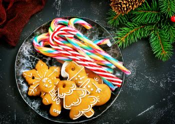 cookies and candycane on a table, christmas background