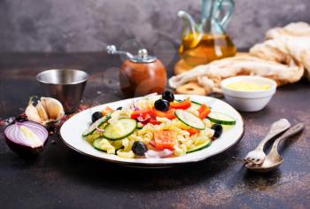 salad with pasta and vegetables on plate