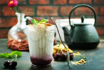 white yogurt with berries and cookies, desert in glass