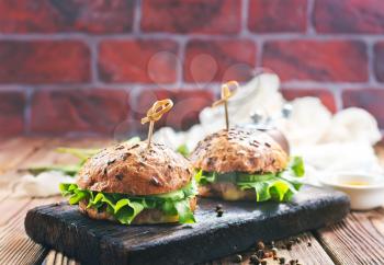 fresh burgers on a table, stock photo