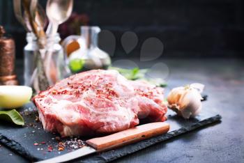 raw meat with salt and spice on a table