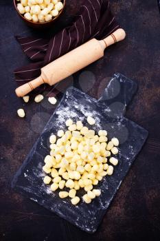 raw potato gnocchi on a table,stock photo