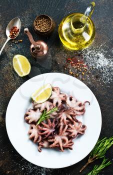 fried octopus on white plate and on a table