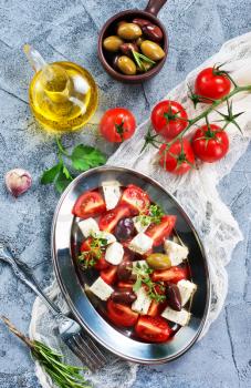 greek salad on plate and on a table