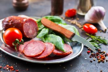 smoked sausage with spice and fresh basil