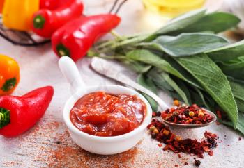 sauce with pepper in bowl, stock photo