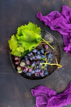 grape on plate and on a table