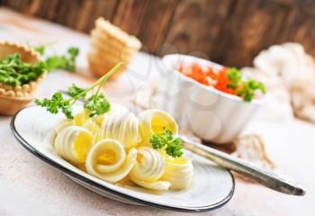 butter on plate and on a table, stock photo