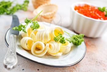butter on plate and on a table, stock photo