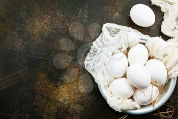 raw eggs on pkate and on a table, stock photo