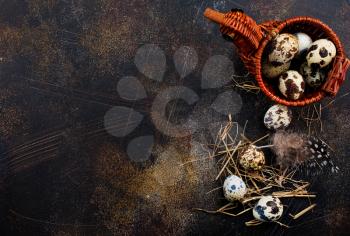quail eggs in basket and on a table, stock photo