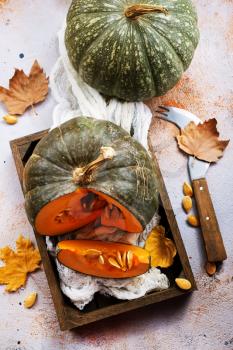 raw pumpkin on a table, stock photo