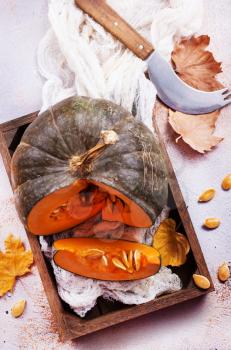 raw pumpkin on a table, stock photo
