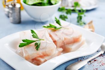 raw fish fillet with salt and spice, white fish