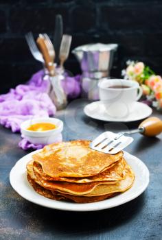 crepes with honey and fresh tea,stock photo
