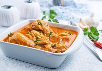 Traditional Indian dish chicken. Spicy chicken curry in bowl 
