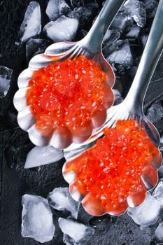 red salmon caviar, salmon caviar in metal spoons