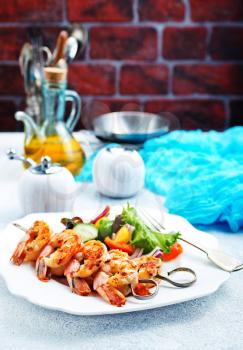 fried shrimps with salad, fried shrimps on sticks, stock photo