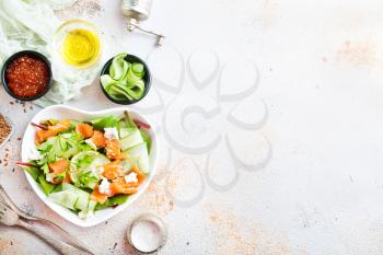 salad with salmon and cremcheese in white bowl