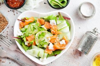 salad with salmon and cremcheese in white bowl