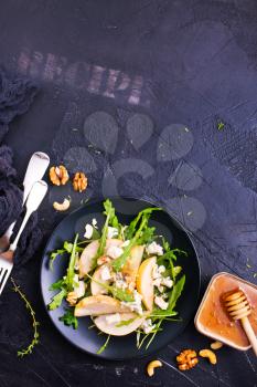salad with fresh pear spinach nuts, diet food,stock photo