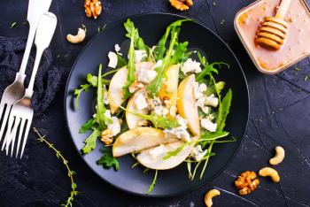 salad with fresh pear spinach nuts, diet food,stock photo