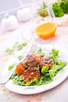 cutlets with sauce and fresh salad, cutlets on white plate