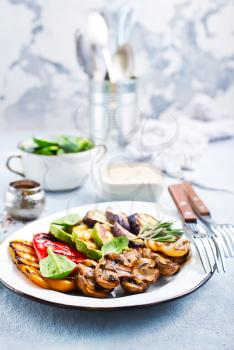 grilled vegetables with sauce on the plate, stock photo