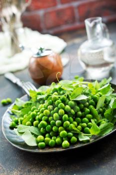 green peas on plate, fresh green peas, stock photo